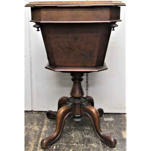 2817 - A Victorian walnut ladies sewing table, the rising lid revealing a segmented interior, the tapering ... 