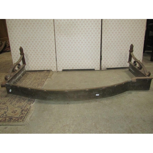 2263 - Two brass fenders, with decorative pierced grills, together with a further brass and ironwork bow fr... 