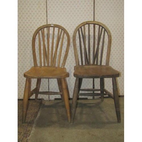 2268 - A Harlequin set of six stripped elm and beechwood hoop and stick back kitchen chairs raised on ring ... 