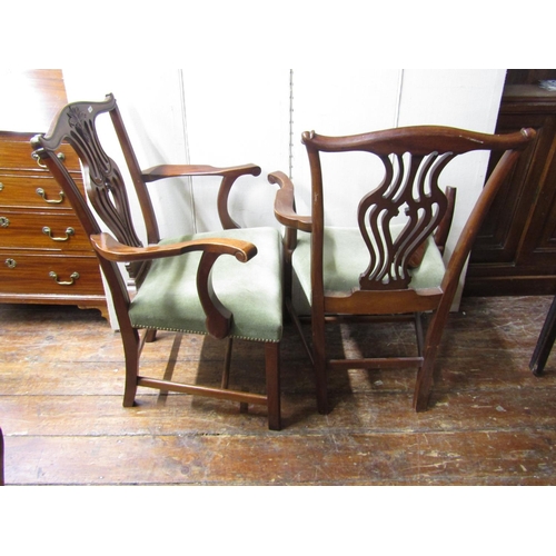 2780 - A set of four Georgian style elbow chairs with carved and pierced splats, stuff over seats and squar... 