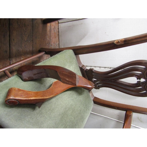 2780 - A set of four Georgian style elbow chairs with carved and pierced splats, stuff over seats and squar... 