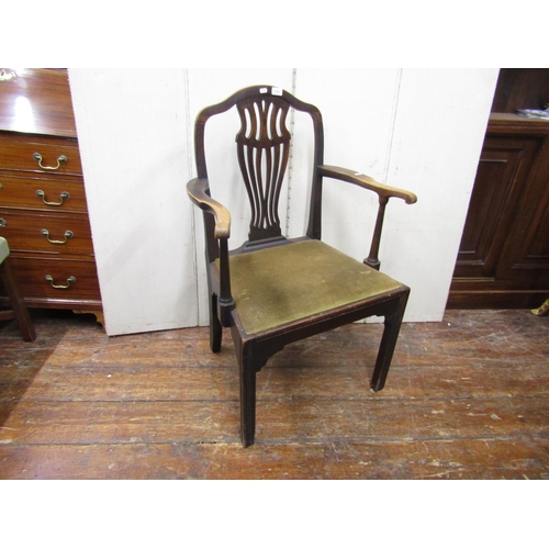 2781 - A Georgian mahogany elbow chair with carved and priced splat and upholstered seat on square cut supp... 