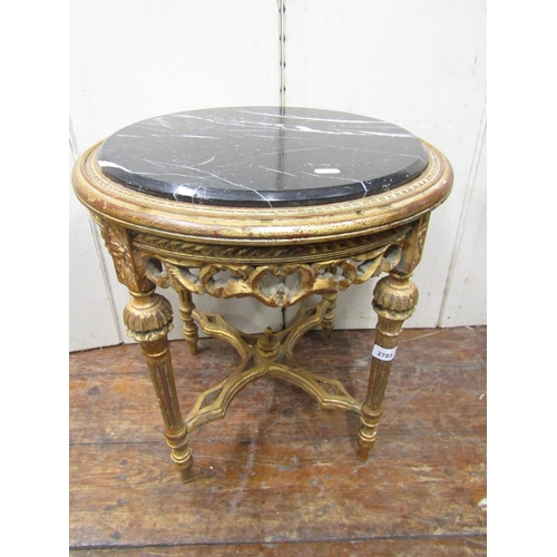 2785 - An occasional table with carved and gilded frame and inset marble top, 52cm high