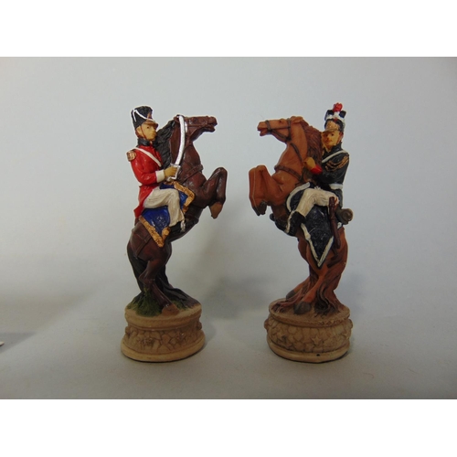 722 - A contemporary novelty resin chess set, the figures showing the battle of Waterloo