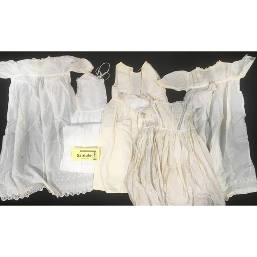 1607 - 15 white baby gowns in white cotton and wool, including 19th century hand stitched gowns trimmed wit... 