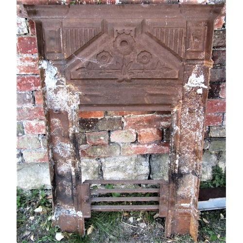 2093 - A late Victorian cast iron bedroom grate with raised relief foliate and fluted detail, painted finis... 