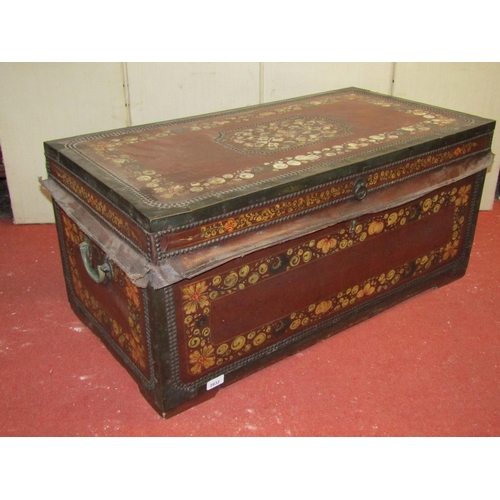 2832 - An early 19th century camphor wood coffer overlaid in leather with maroon coloured finish, with bras... 