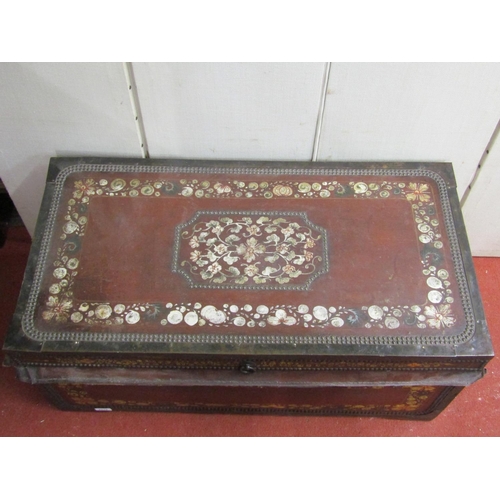 2832 - An early 19th century camphor wood coffer overlaid in leather with maroon coloured finish, with bras... 