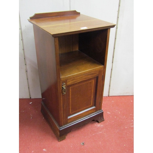 2835 - An inlaid Edwardian mahogany bedside cupboard, the lower section enclosed by a panelled door, with s... 