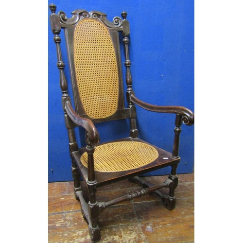 2840 - A 17th century and later Carolean elbow chair in walnut, with turned supports, cane panelled seat an... 