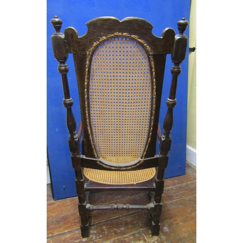 2840 - A 17th century and later Carolean elbow chair in walnut, with turned supports, cane panelled seat an... 