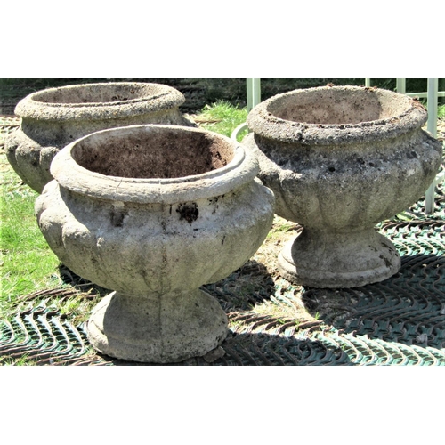 2081 - A set of three reclaimed garden urns, with circular lobed form, approx 40cm diameter x 33cm high (af... 