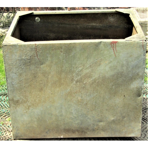 2099 - A reclaimed galvanised steel ships toilet of oval form with hinged lid and some fittings, 78 cm long... 