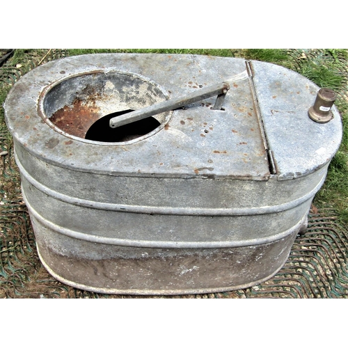 2099 - A reclaimed galvanised steel ships toilet of oval form with hinged lid and some fittings, 78 cm long... 