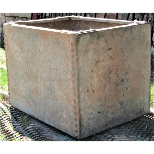 2102 - A reclaimed galvanised steel water tank of rectangular form with pop riveted seams, 61 cm long x 44 ... 