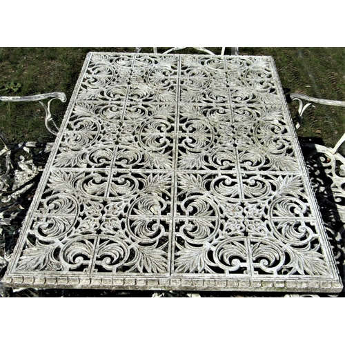 2104 - A cream painted cast aluminium garden terrace table of rectangular form with decorative pierced foli... 