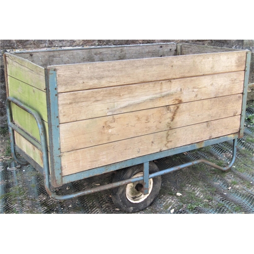 2108 - An industrial iron framed two wheeled hand cart with tongue and groove timber body and pneumatic tyr... 