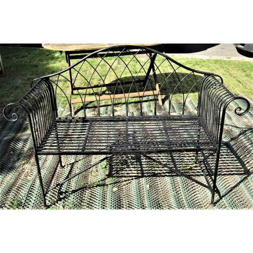 2112 - A Regency style two seat painted light metal garden bench with arched lattice back, scrolled arms, s... 