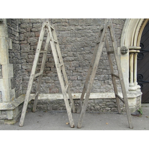 2062 - A pair of substantial vintage A framed folding trestles, 220cm high, together with three further pin... 