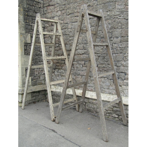 2062 - A pair of substantial vintage A framed folding trestles, 220cm high, together with three further pin... 