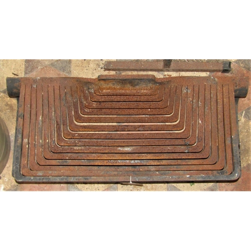 2161 - An unusual low artisan design cast iron fire basket of rectangular form with graduated bars, approx ... 