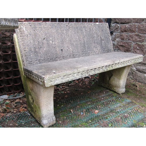 2217 - A reclaimed garden table, the circular top with foliate detail and chevron border, raised on a scrol... 