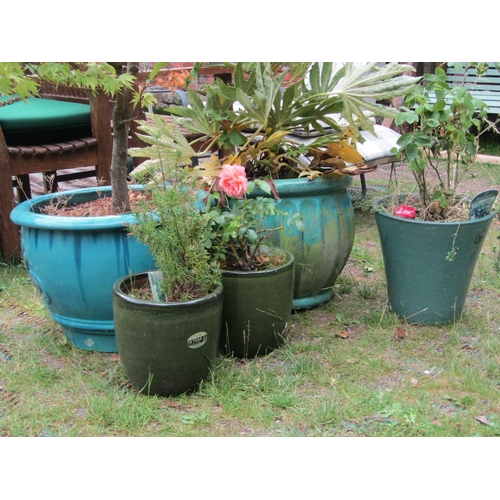 2218 - Two contemporary turquoise glazed planters of varying design, 56 and 50cm diameter approx, together ... 