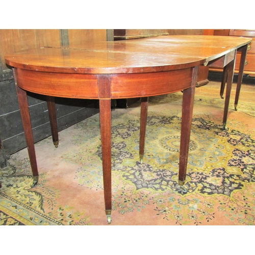 2839 - A Georgian mahogany D end dining table raised on twelve square tapered supports, 270cm long x 105cm ... 