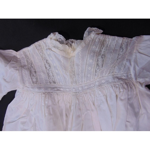 1629 - Suitcase containing 15 late 19th/ early 20th century white baby gowns, many with hand made lace trim... 