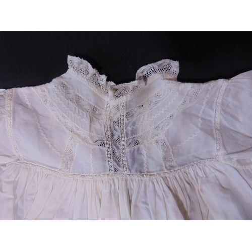 1629 - Suitcase containing 15 late 19th/ early 20th century white baby gowns, many with hand made lace trim... 