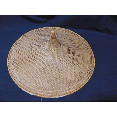 1631 - Oriental sampan type coolie hat comprised of woven cane work over paper, with further weaving on the... 