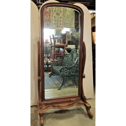 2294 - A reproduction Victorian style mahogany cheval mirror with scrolled and moulded supports united by a... 