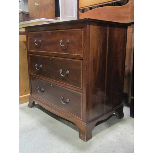 2324 - An inlaid Edwardian mahogany dressing chest of three long drawers raised on splay bracket supports t... 