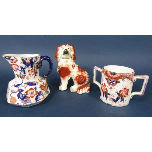 75 - A 19th century Staffordshire spaniel with red painted patches and separate forelegs, a graduated set... 