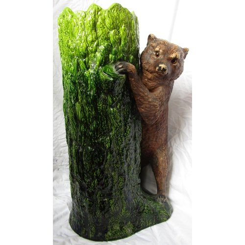 82 - A late 19th century umbrella stand, possibly by Bretby in the form of a bear climbing a tree trunk, ... 