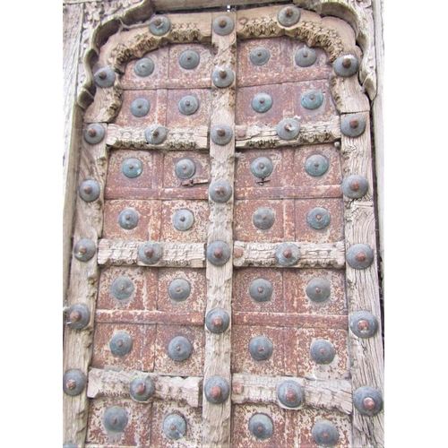 66 - An antique Indian hardwood panel with carved detail, the centre section in steel and brass overlaid,... 