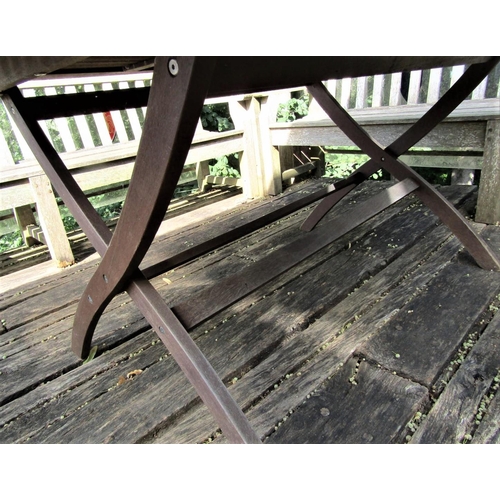 70 - A good quality weathered teak garden table with slatted top and folding x shaped frame, 155cm x 95cm... 