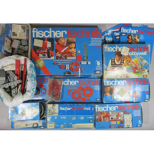 672 - A box of Fischer Technik model building kits, transformer, spare parts, instruction books etc,  unch... 