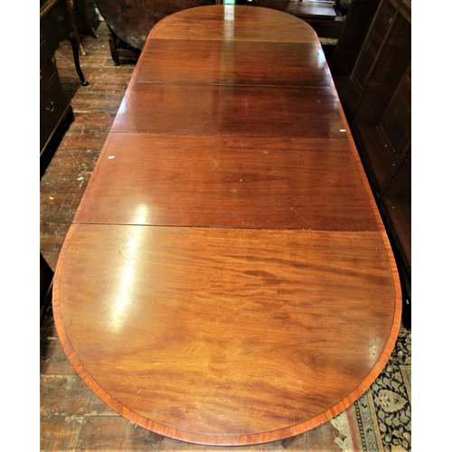 2159 - A Georgian mahogany D end extending dining table crossbanded in satinwood comprising a pair of D end... 