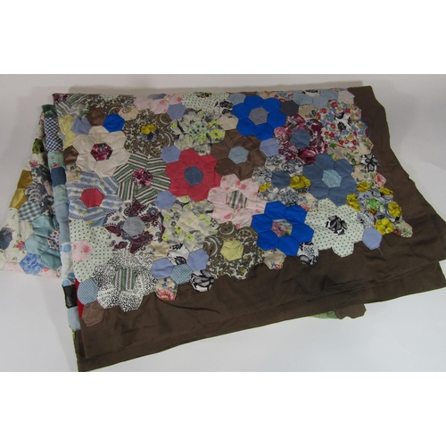 483 - Vintage traditional patchwork quilt with multi coloured hand stitched hexagonal 'flowers' surrounded... 