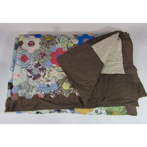 483 - Vintage traditional patchwork quilt with multi coloured hand stitched hexagonal 'flowers' surrounded... 