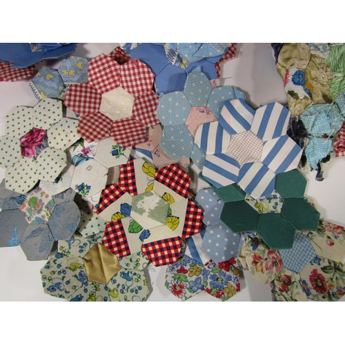 493 - A partially completed patchwork quilt, unlined and unfinished; stitched area is approx. 100 x 140 cm... 