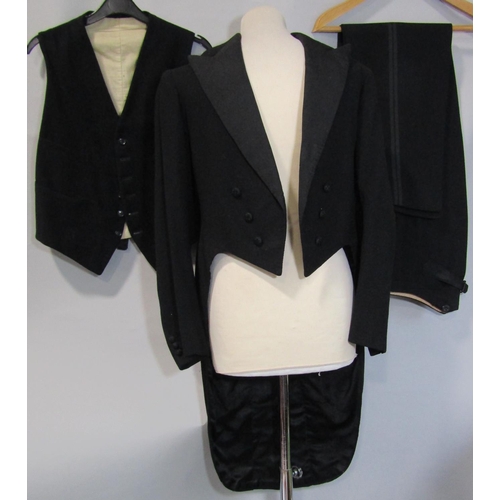 486 - 2 vintage gentlemen's tailored dress suits including a tailcoat with black quilted lining and decora... 