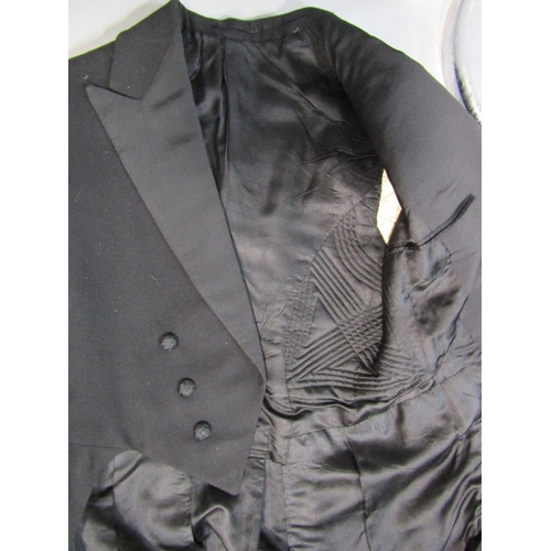 486 - 2 vintage gentlemen's tailored dress suits including a tailcoat with black quilted lining and decora... 