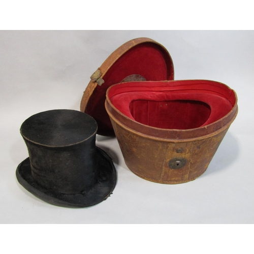 495 - Black silk top hat (AF) in velvet lined leather hat box together with a leather suitcase with fitted... 