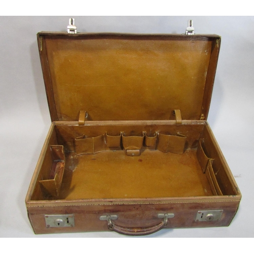 495 - Black silk top hat (AF) in velvet lined leather hat box together with a leather suitcase with fitted... 