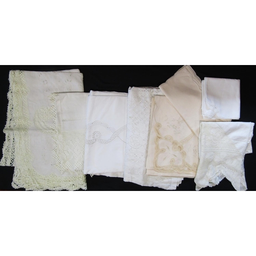 498 - Suitcase full of good quality white vintage table cloths including 4 large white cloths with crochet... 