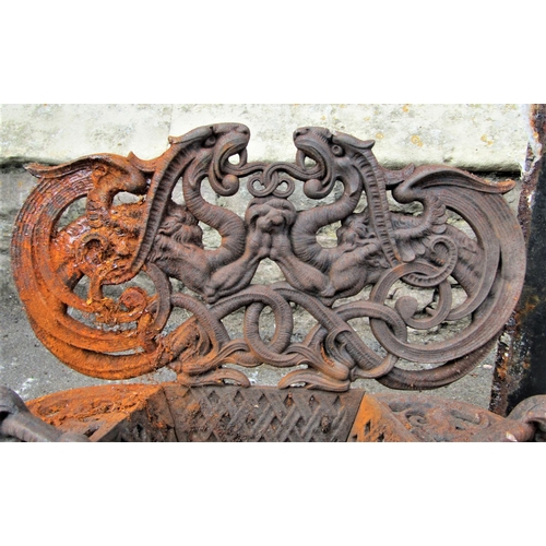 1528 - A small reclaimed cast iron fire basket, with scrolling dragon, shell and lattice detail, 54cm (full... 