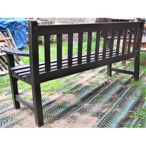 1551 - A stained teak three seat garden bench with slatted seat and back, probably Lister (af) 158cm wide