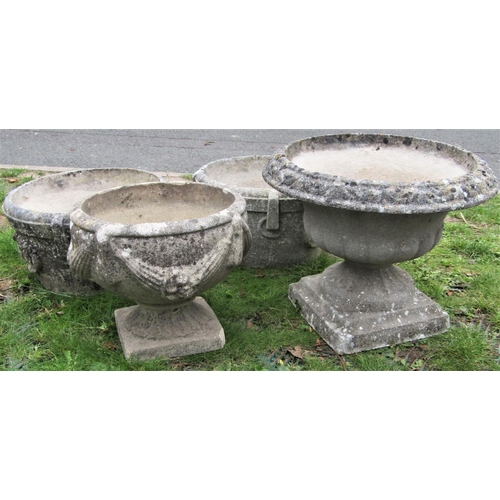 1565 - Four reclaimed garden urns, of varying design to include a pair of circular form with repeating ring... 